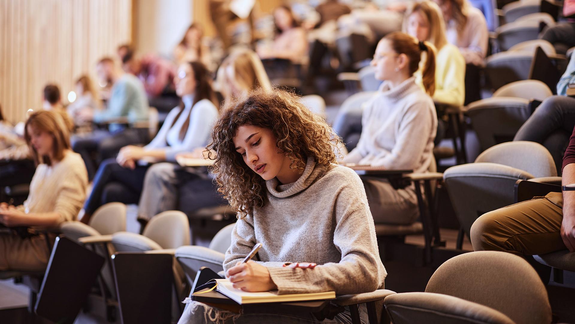Students taking notes in class